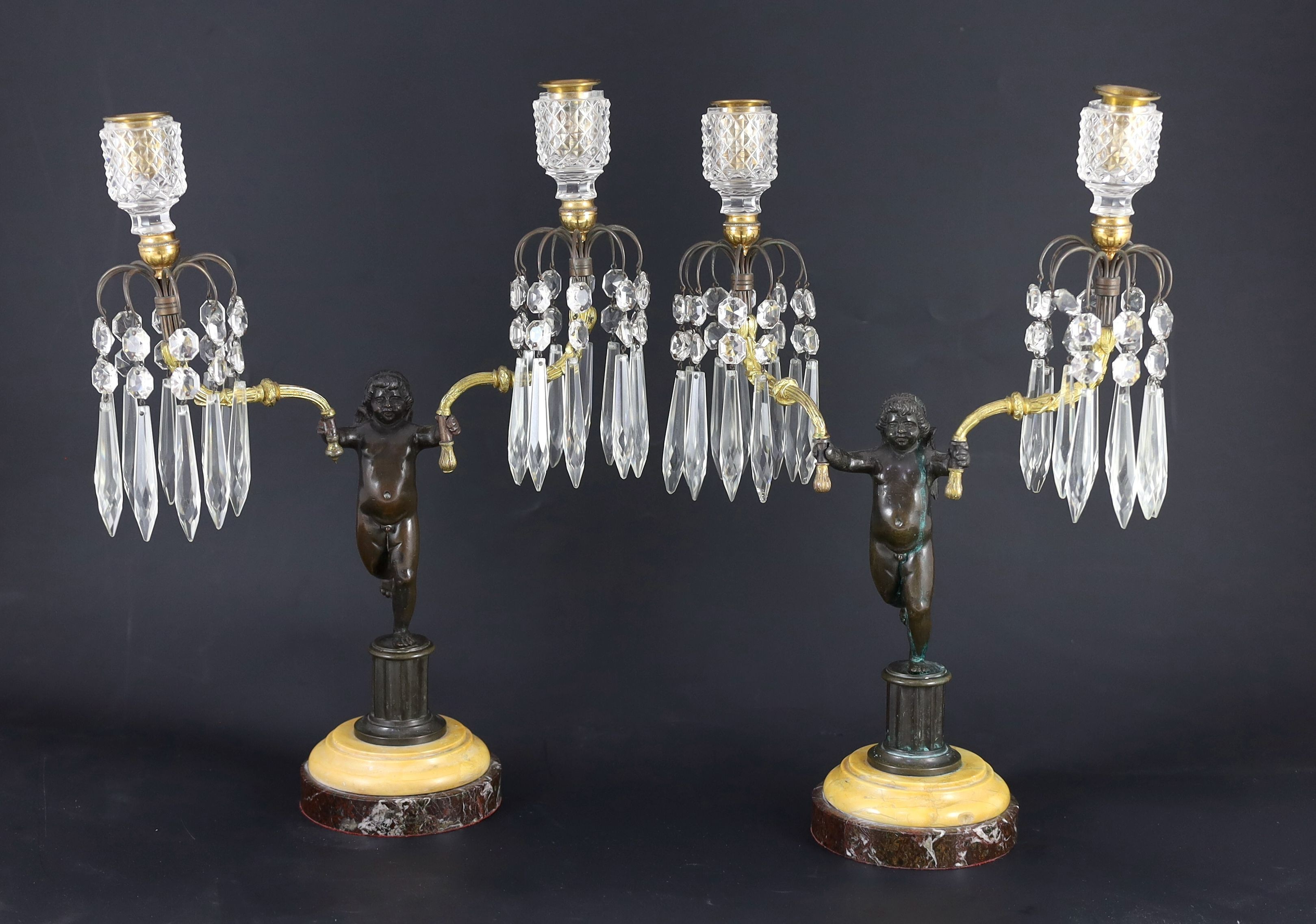 A pair of early 19th century bronze and ormolu figural candelabra, width 30cm, height 42cm